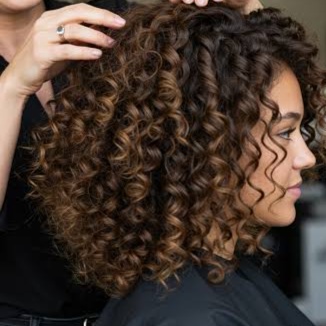 Woman's Curly Haircut at Angie Carnathan at Daisy & Sage Hair Studio in Starkville, MS
