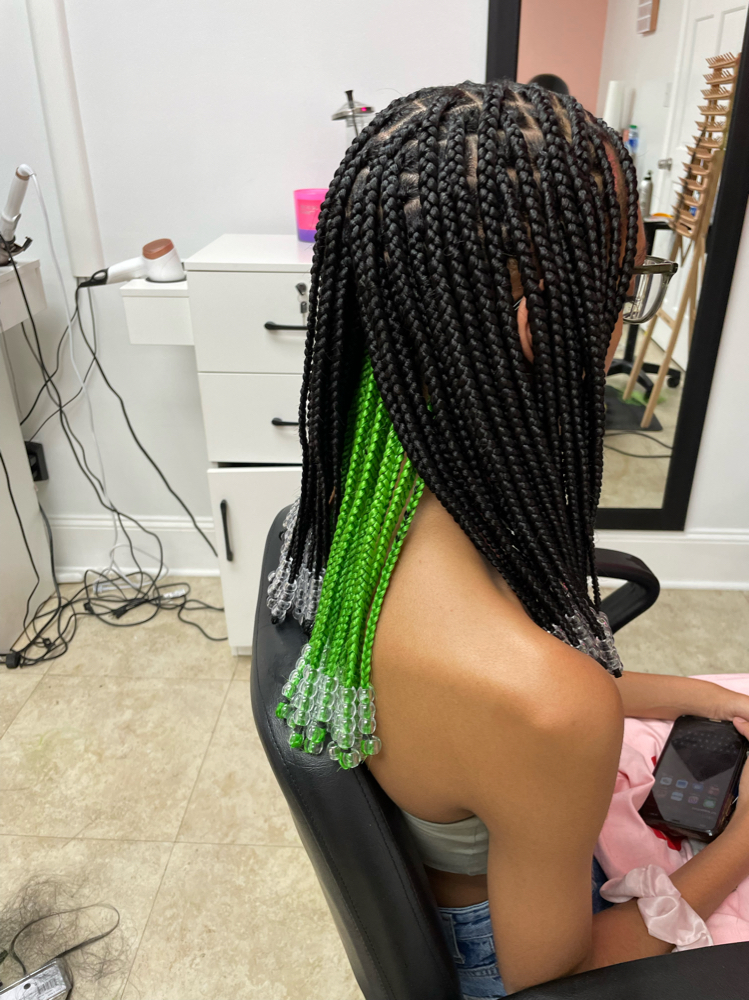 Knotless Braids: A Revolution in Braided Wig Styling - Bounce Magazine