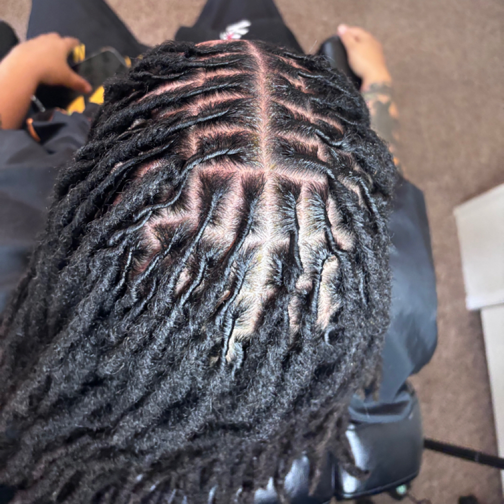 Retwist Only Ear Length at The Island Girl Collection LLC in hinesville, GA