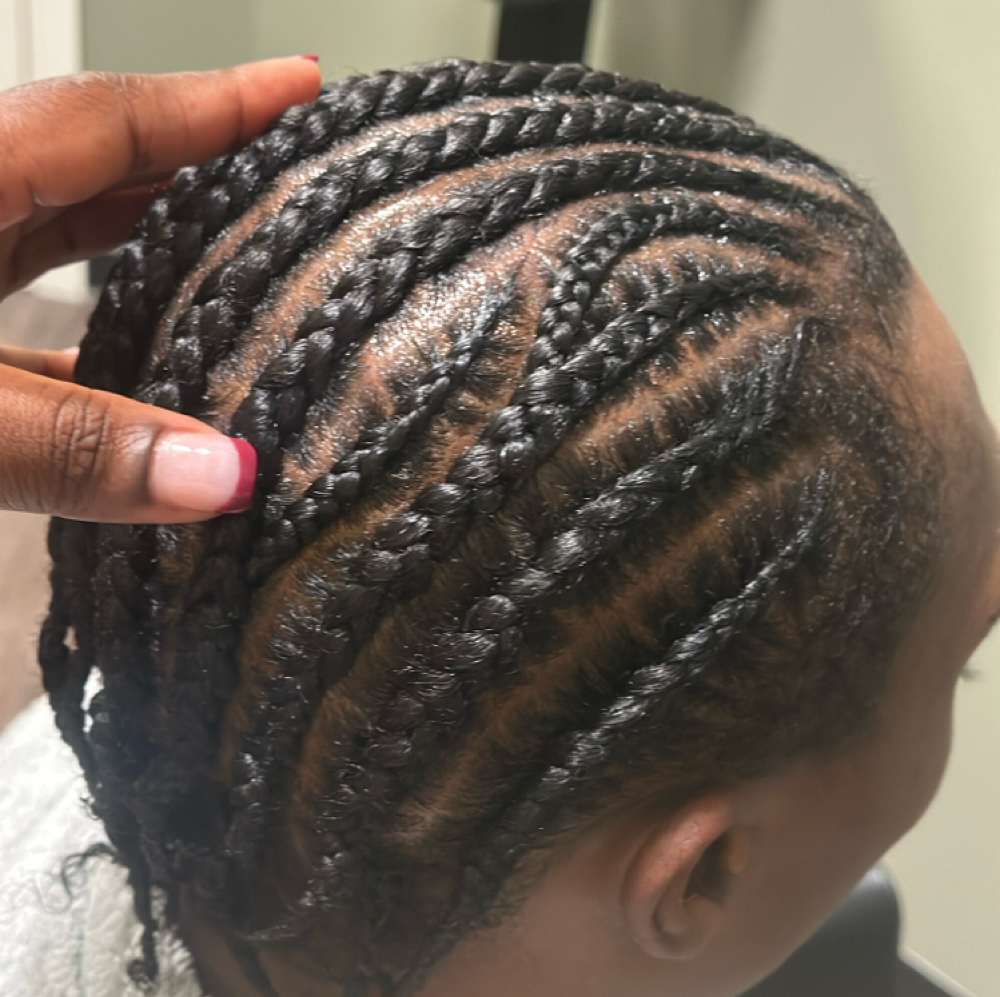 Straight Back Cornrows with Design at WestAfrican Beauty Junction Braids in Prosper, TX