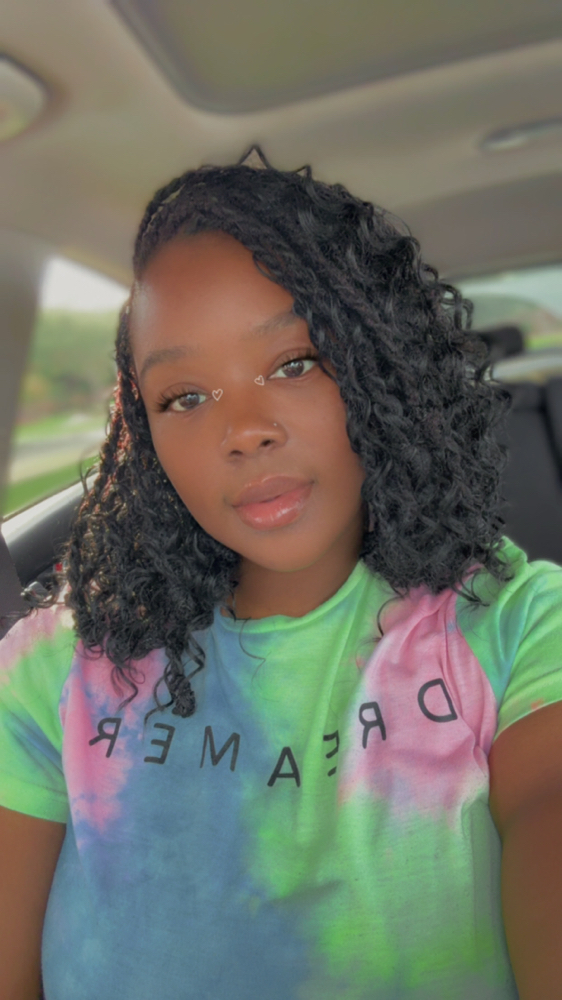 Loc Knot Bob w/curly hair at Thahairtherapist in Houston, TX