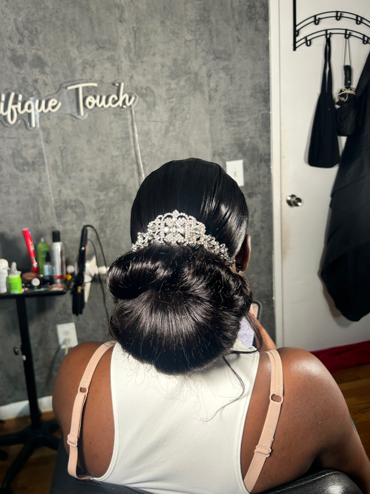 Low, freestyled bun ponytail