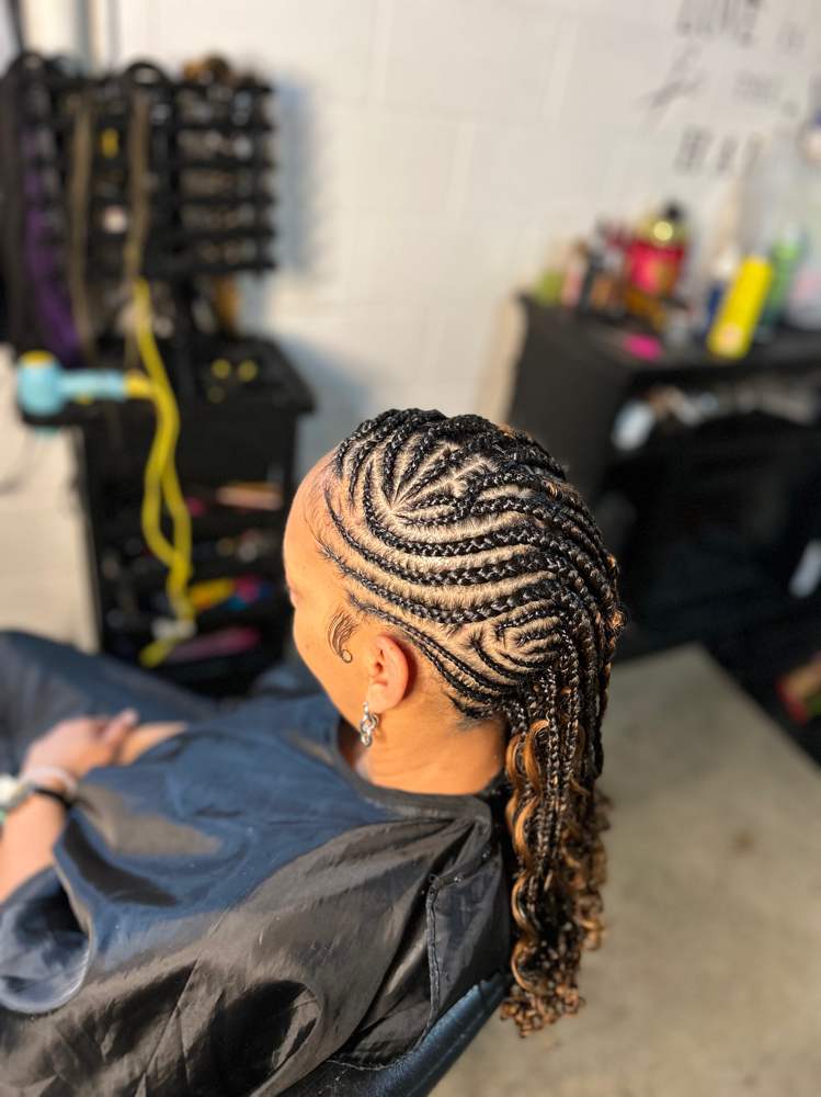 Half mowhawk Knotless Braids at L&B House Of Beauty in Bluegrass, IA