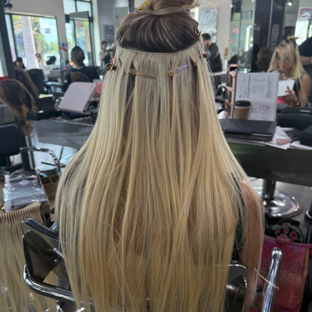 Hair extensions consultation at All About Me Beauty Bar in Labelle, FL