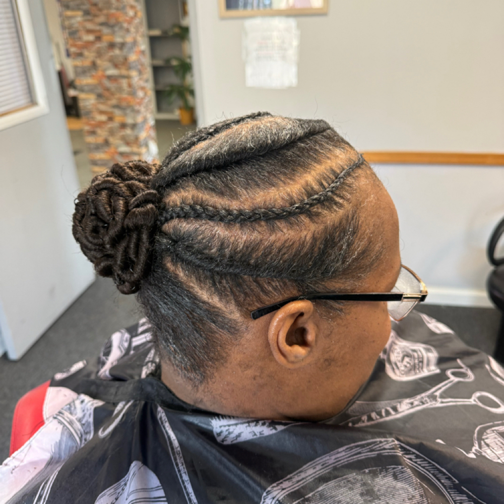Flat Twist w/Coil Bun at Chiffon’s Hair Suite in Lansing, MI