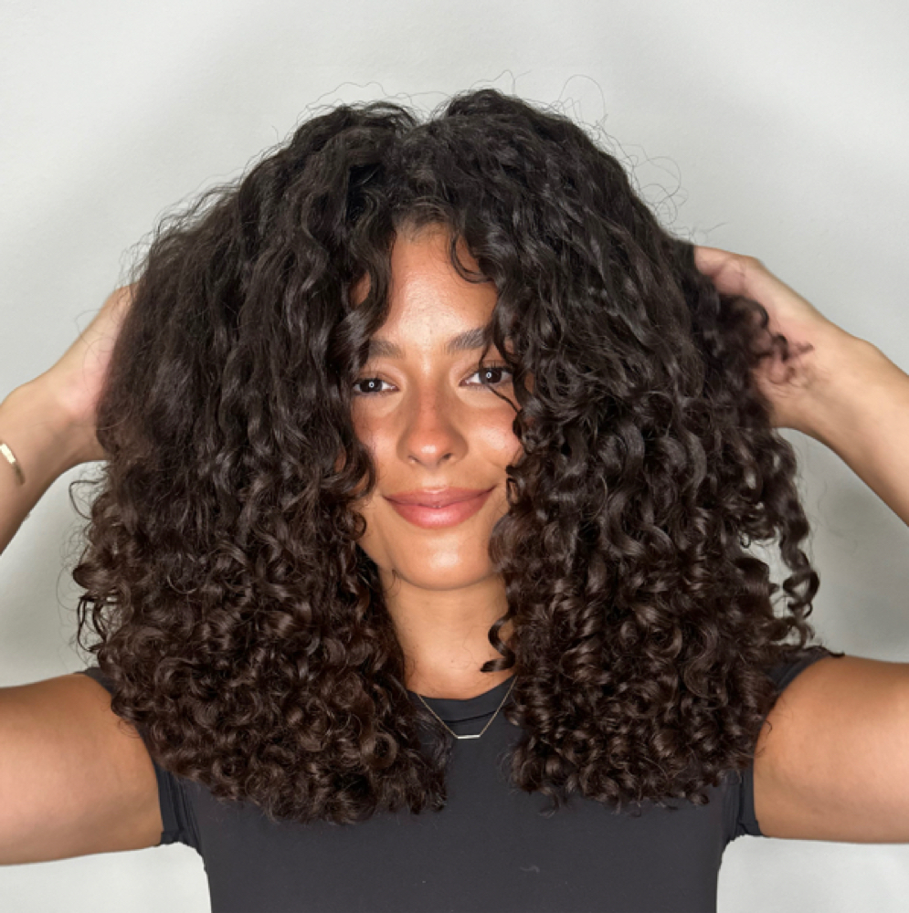 Finger Coiling Style/Styling at Curl Up & Dye NYC Precision cuts. Intentional color. Elevated curls. in New York, NY