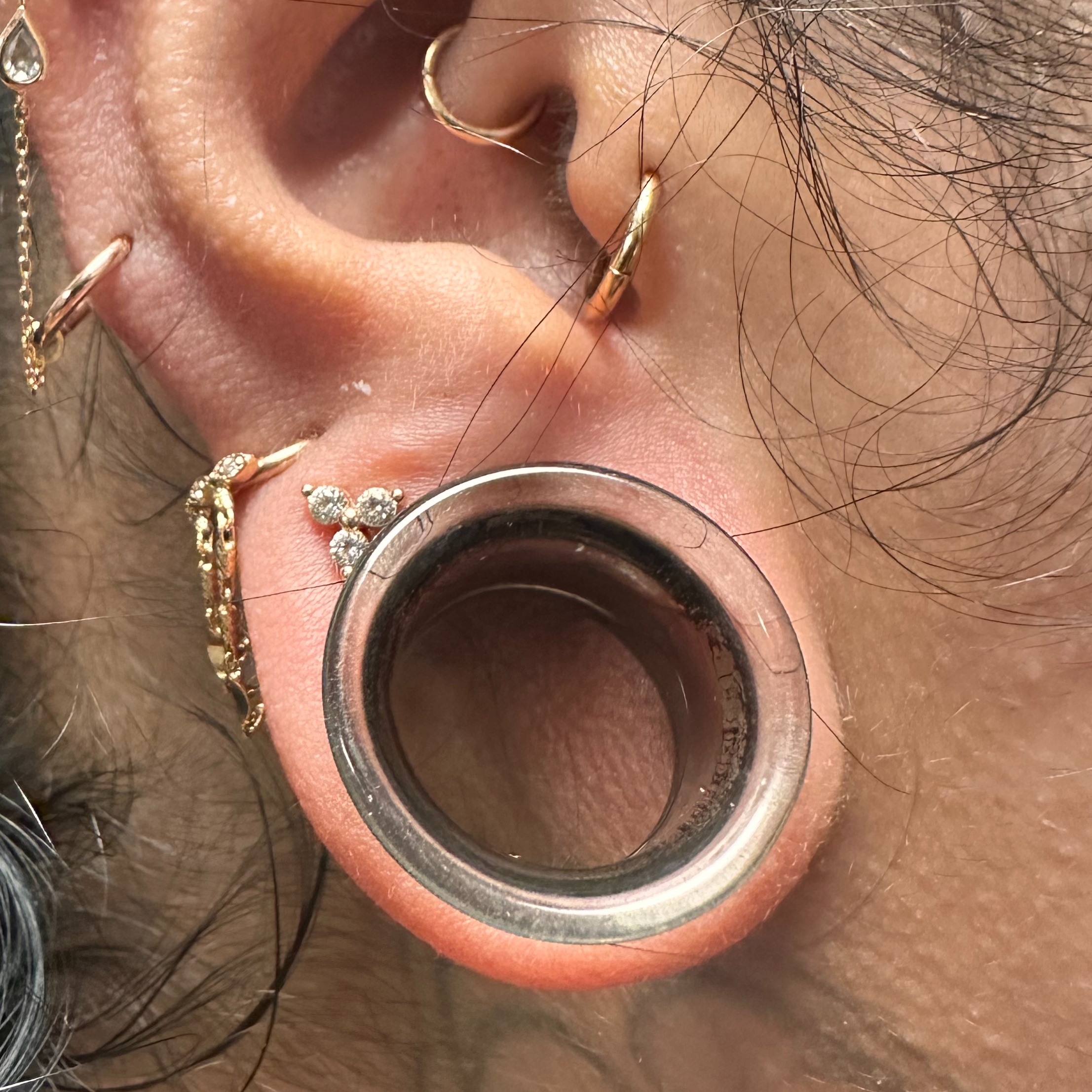 Ear lobe stretching at Kissed By A Needle in North Providence, RI