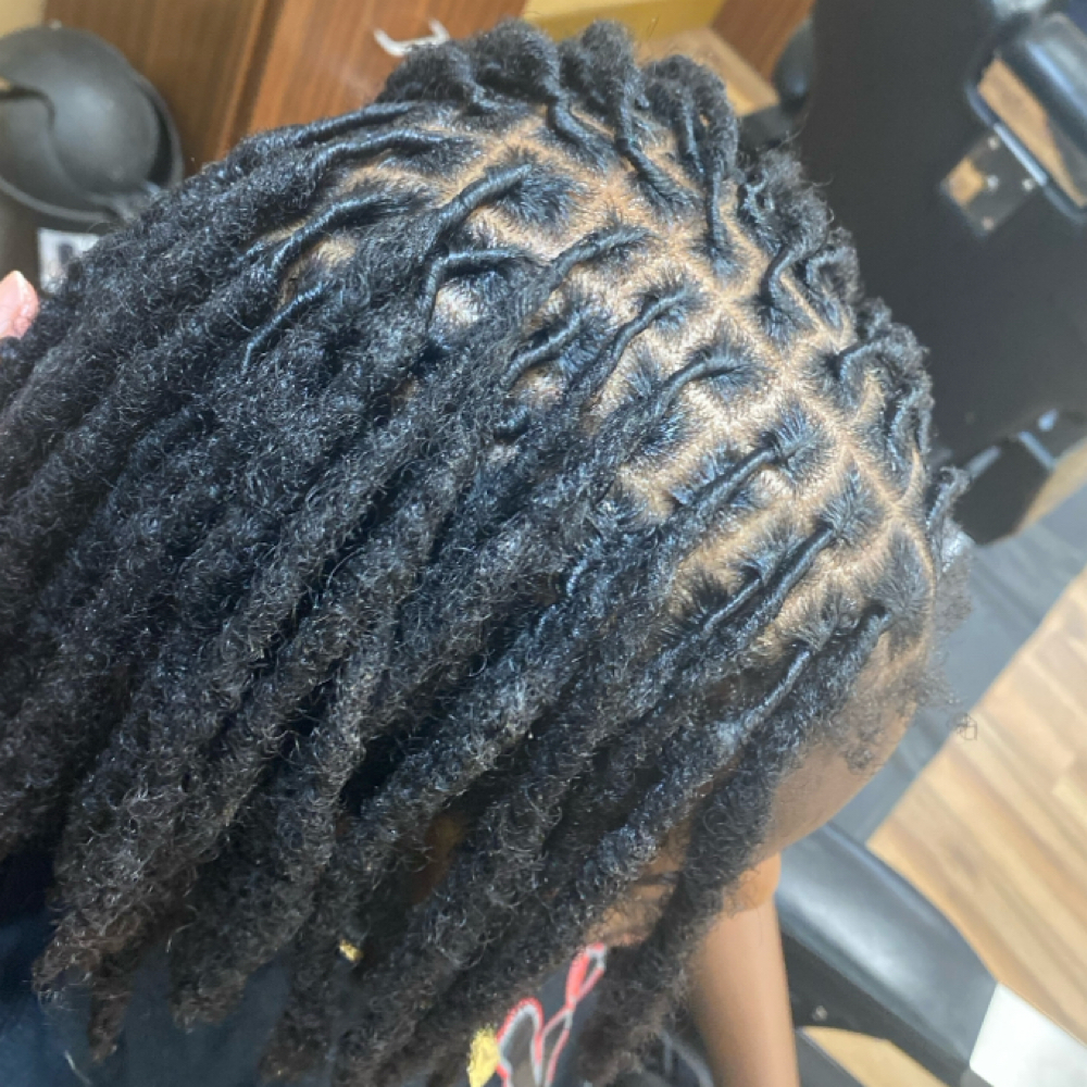 TRADITIONAL LOC RETWIST at Crowned by Vee in Warner Robins, GA