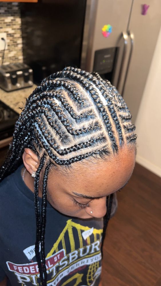 Tribal braids or Feed-Ins w/ plaits