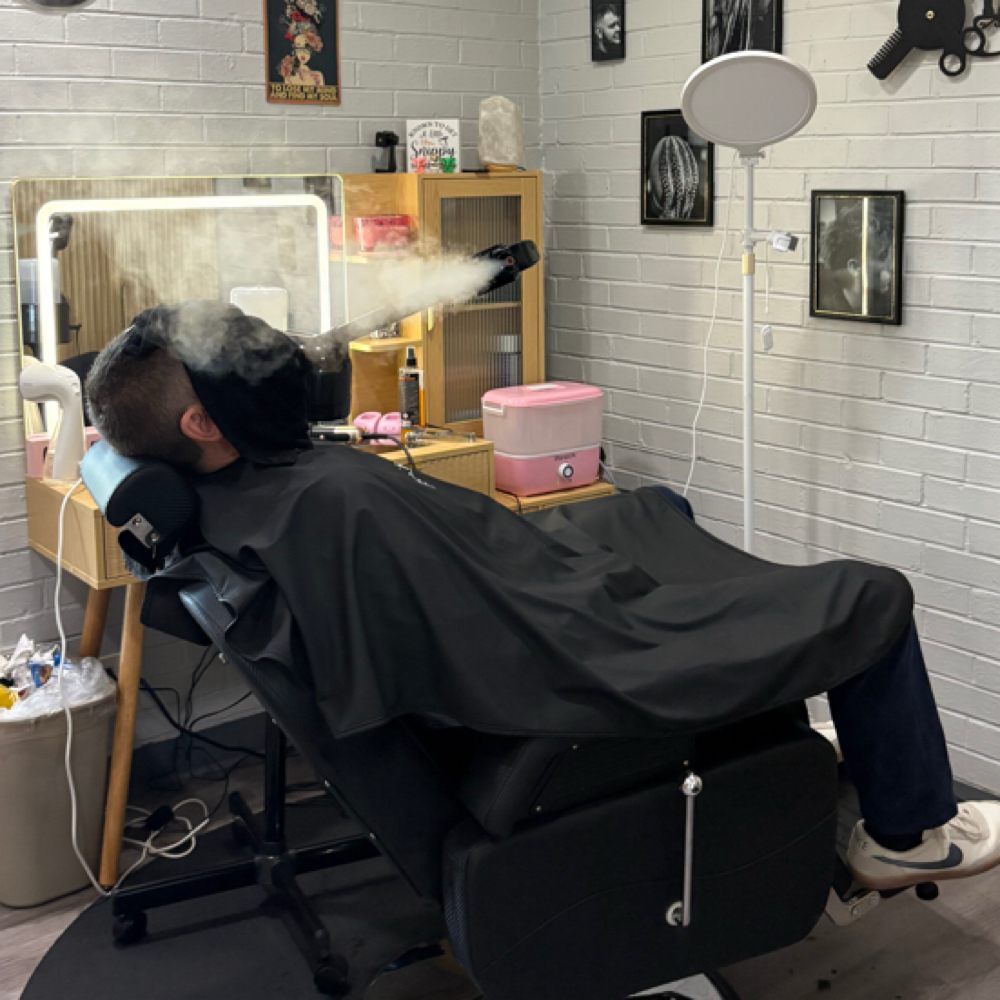 Hot Towel With Steamer at Braids and Fades in Tulsa, OK