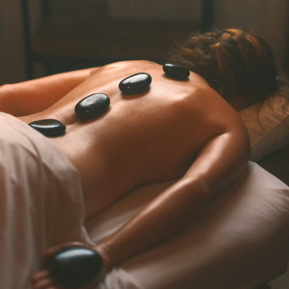 Holistic Hot Stone Massage at Holistic Wellbeings Skin Spa & Massage Clinic in St. Augustine, FL
