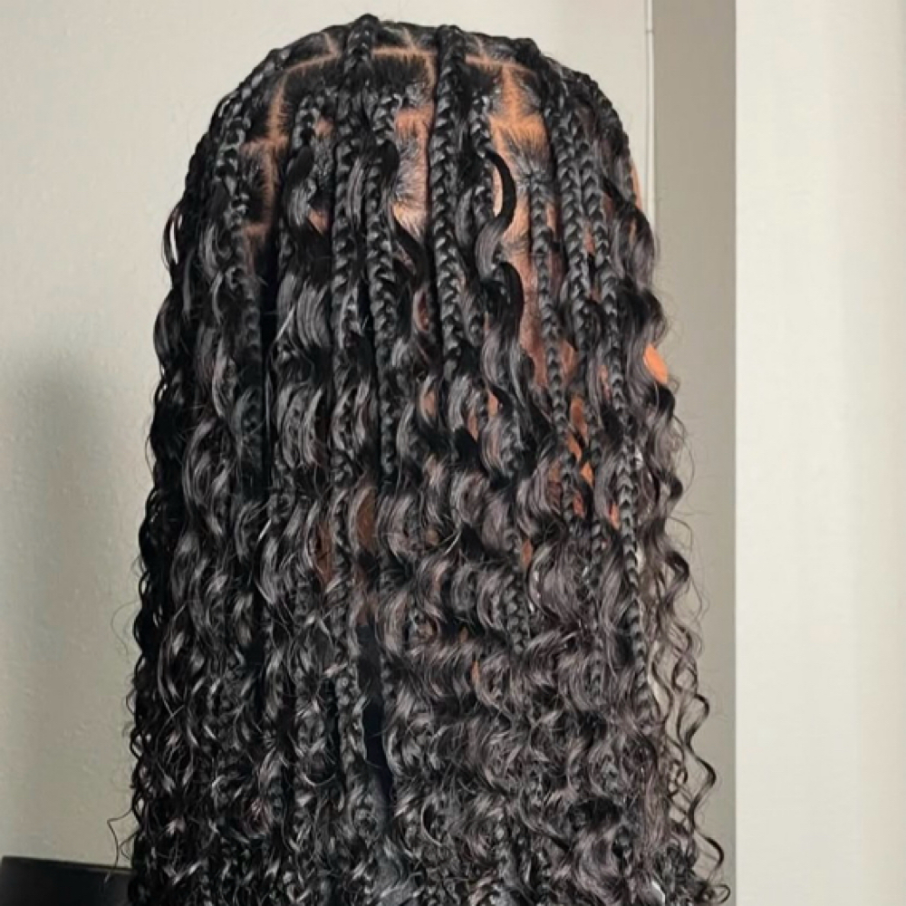 Medium Boho Knotless at Rooted crowns beauty lounge in Tampa, FL