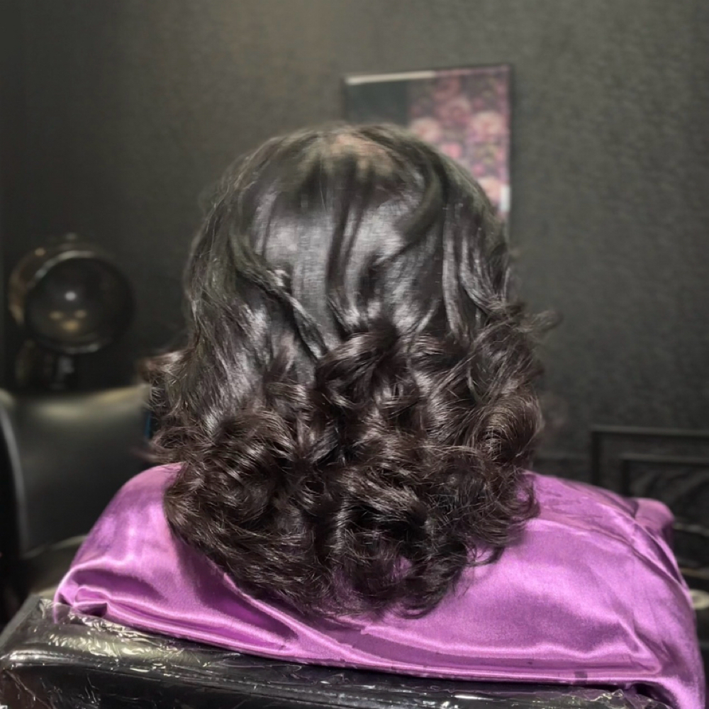 The Duchess Silk Press at The Royale Touch Hairtique in Houston, TX