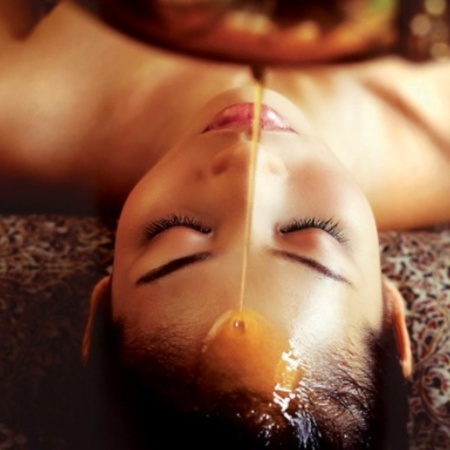 Warm oil scalp massage at Celestial Massage and Bodywork in Aurora, CO