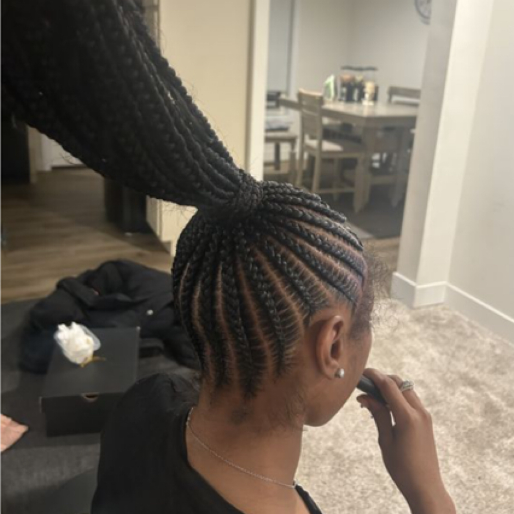 medium braided ponytail at GLOW Spa Tanning & Fitness in Owego, NY