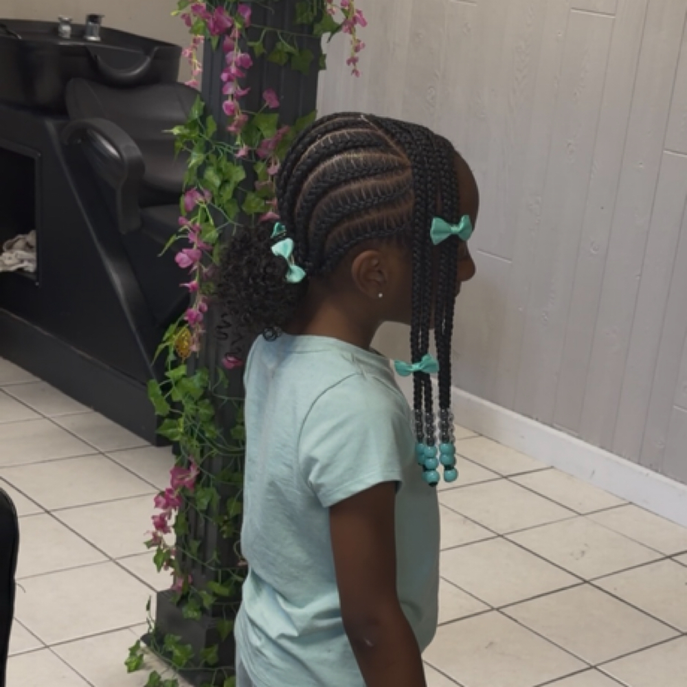 Two Low Buns With Bang at B. Braided in Southfield, MI