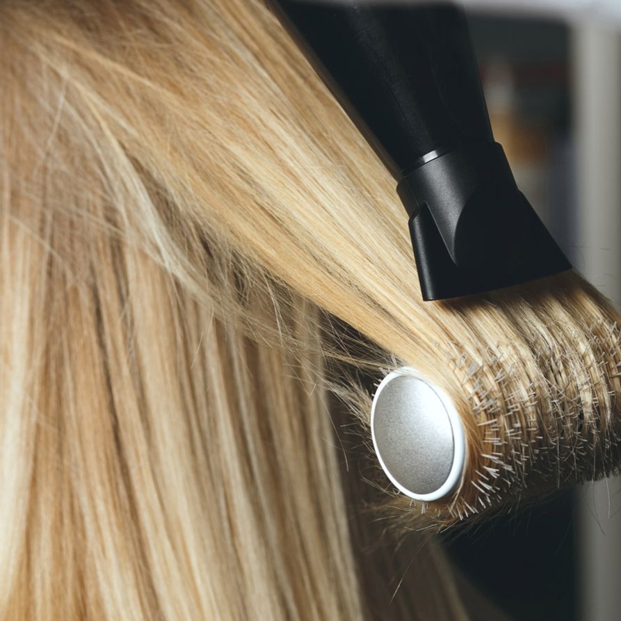blowdry w flat iron at L&G Hair and Nails Salon in Long Beach, NY