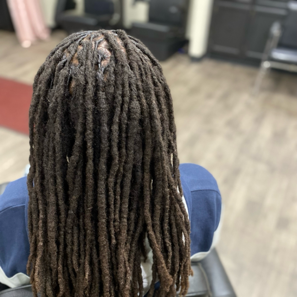 Locs Retwist - Lower Back at Crowned Braids Salon in Conway, SC