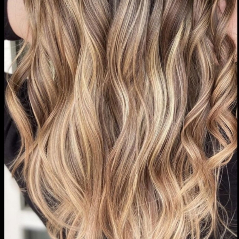 Hair extensions tape-in at Kuttin-Up Studio in Cape Coral, FL