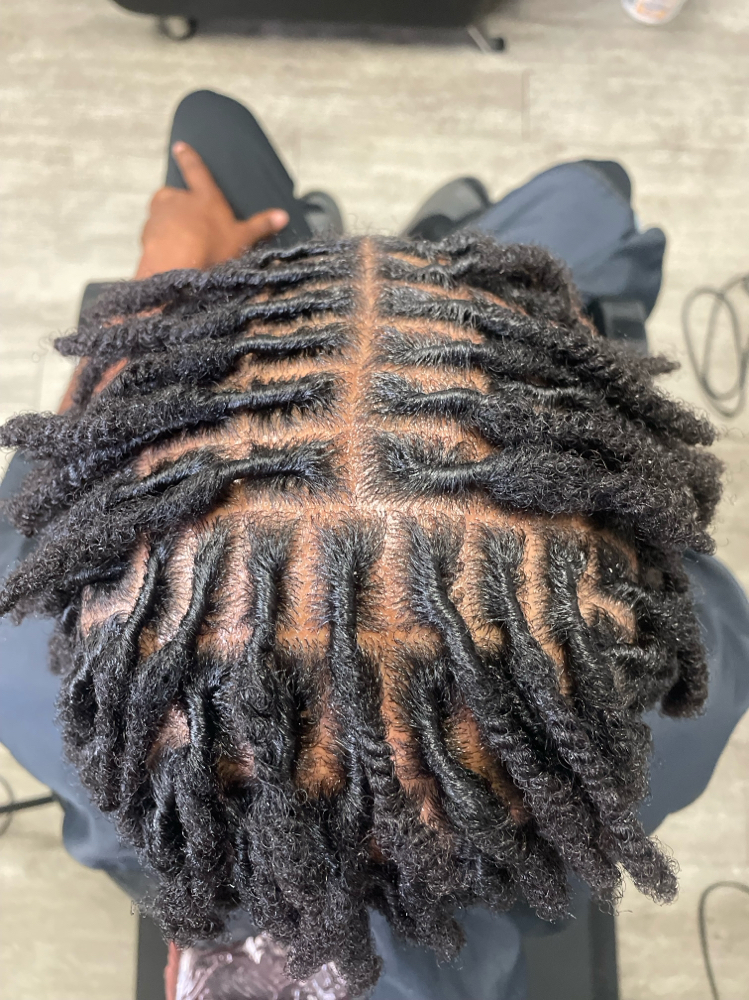 LOC RETWIST-UP TO MID BACK LENGTH at T.I.N.A. Beauty in Inglewood, CA