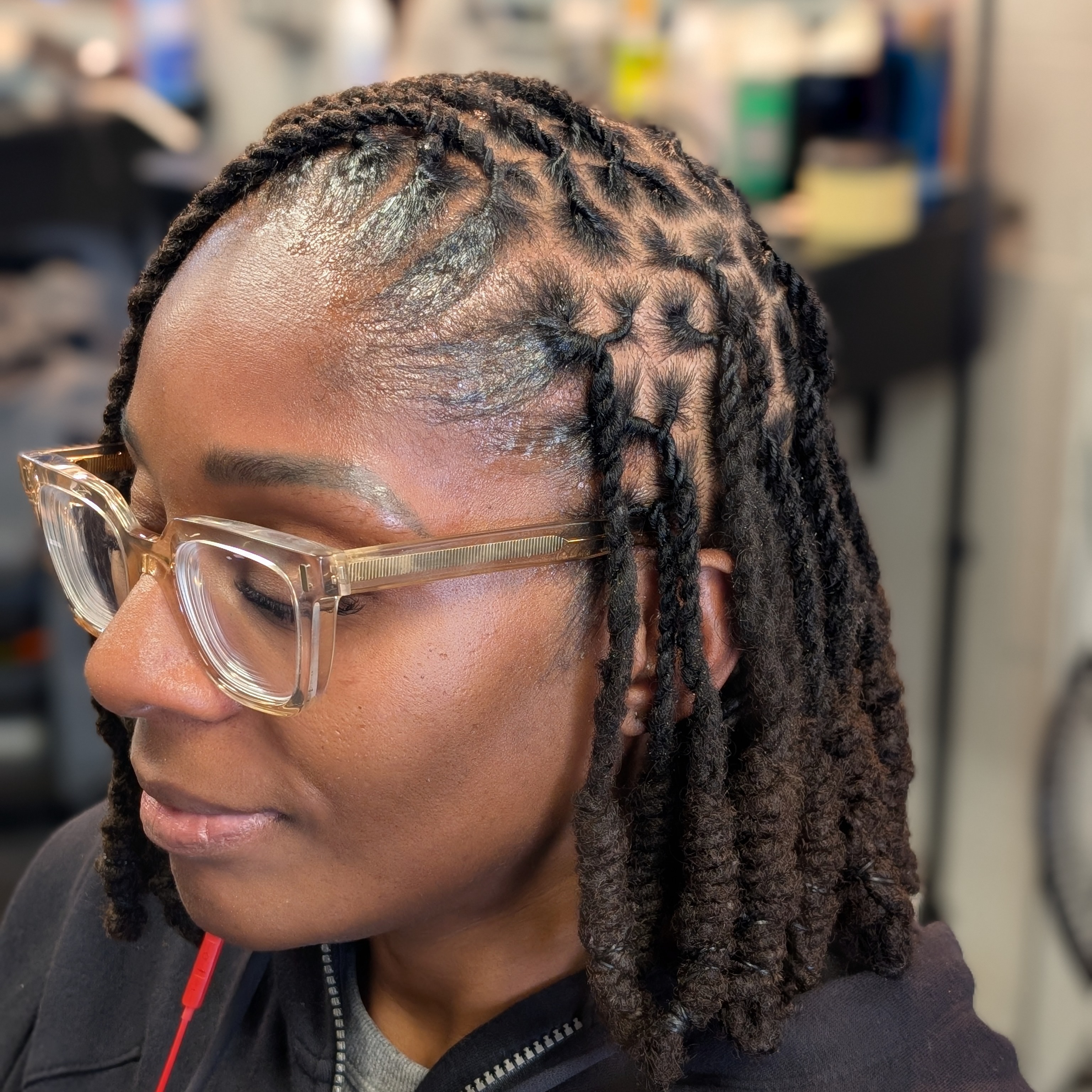 Loc Retwist and 2strands twist at Antonio Carter in Indianapolis, IN