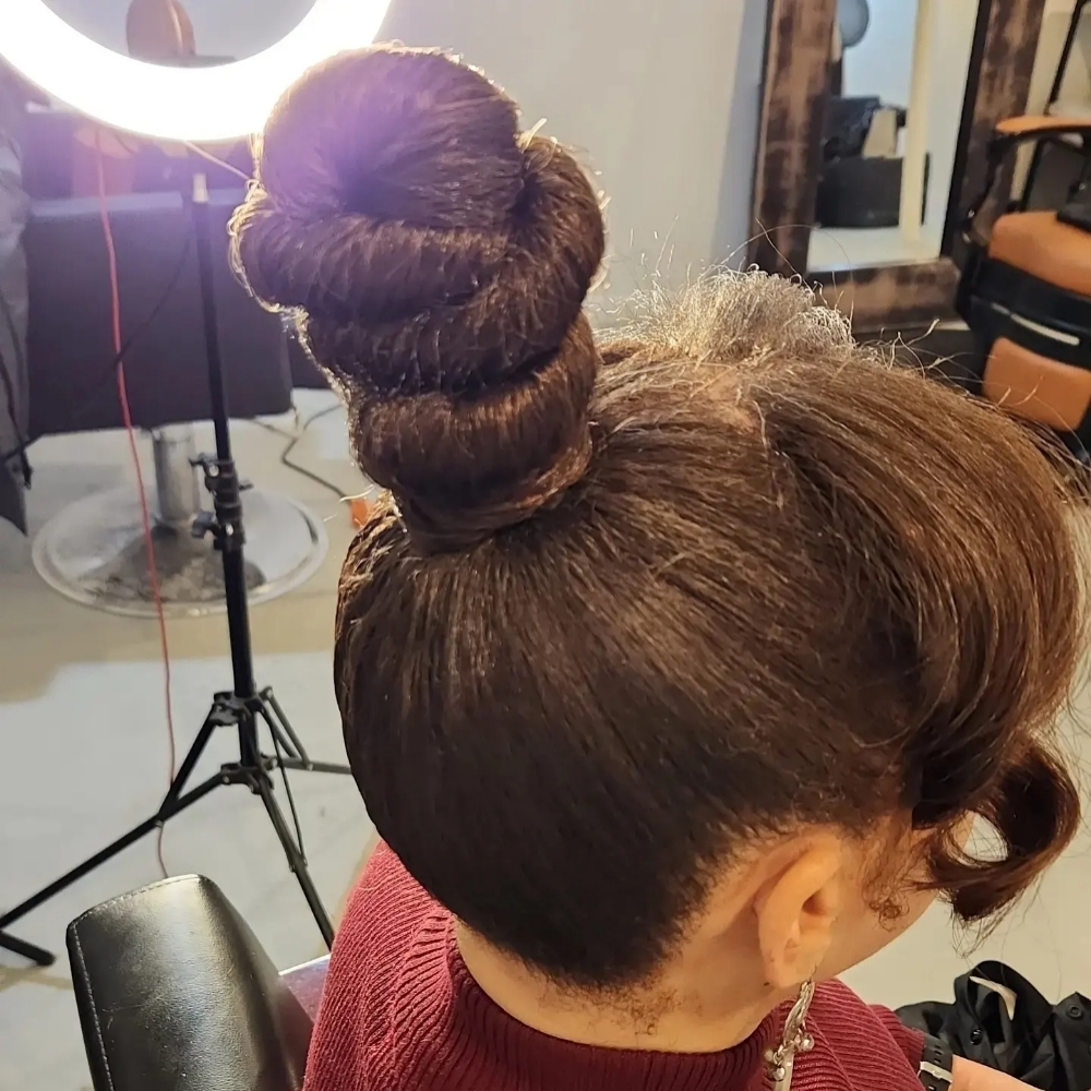Sleek Bun at Billion Hairs Salon in Kansas City, KS