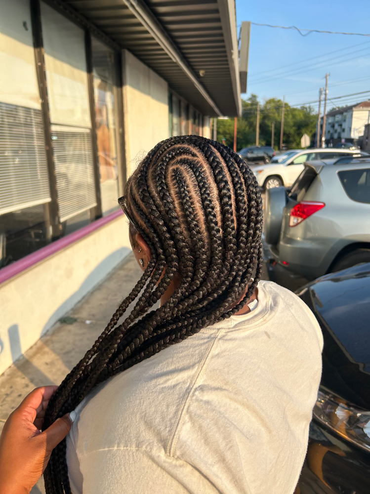 Women Feed-In Braids at Intrinsting Styles in Addison, TX