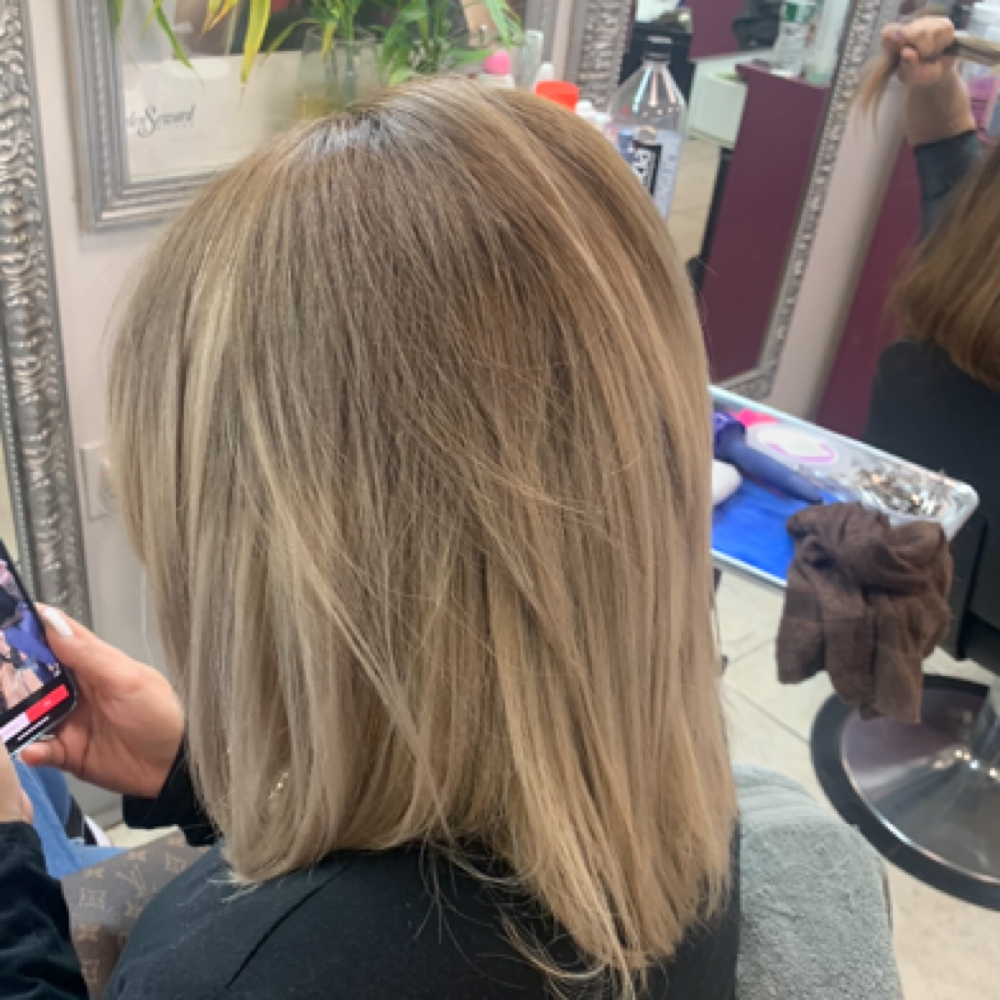 hair cut and style at Giselles hairstyle corp. in Bronx, NY