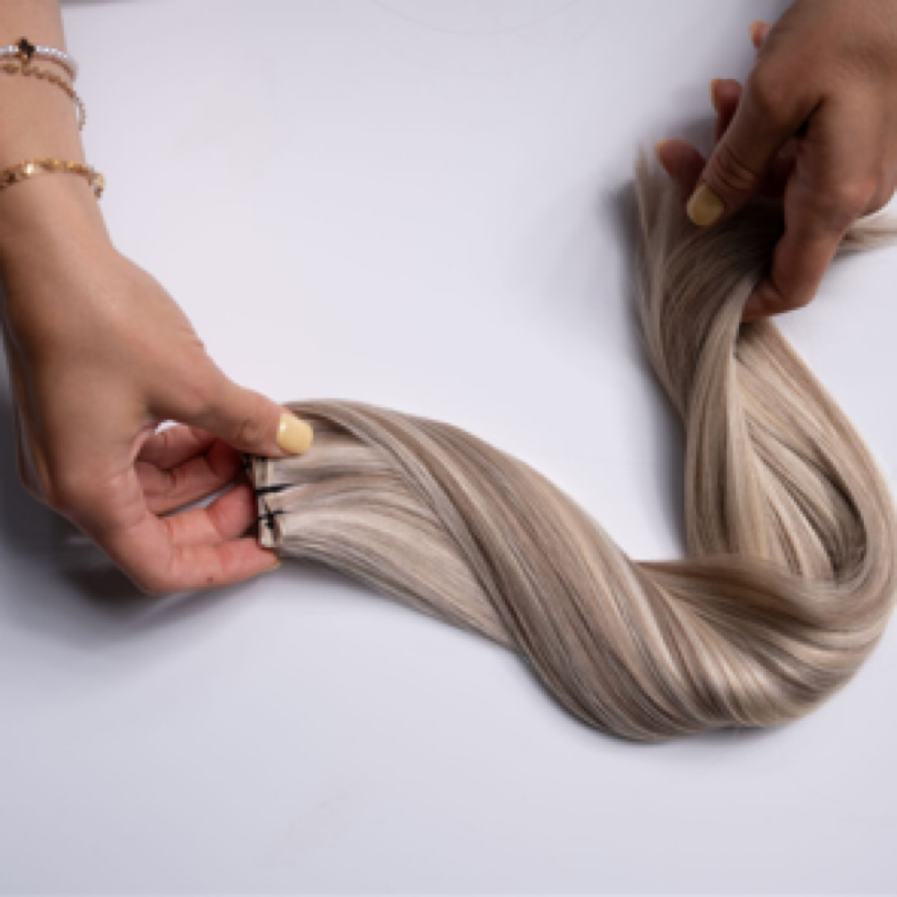 Solaire Hair Extensions Re-install at Evolution 'Aire Salons in Houston, TX