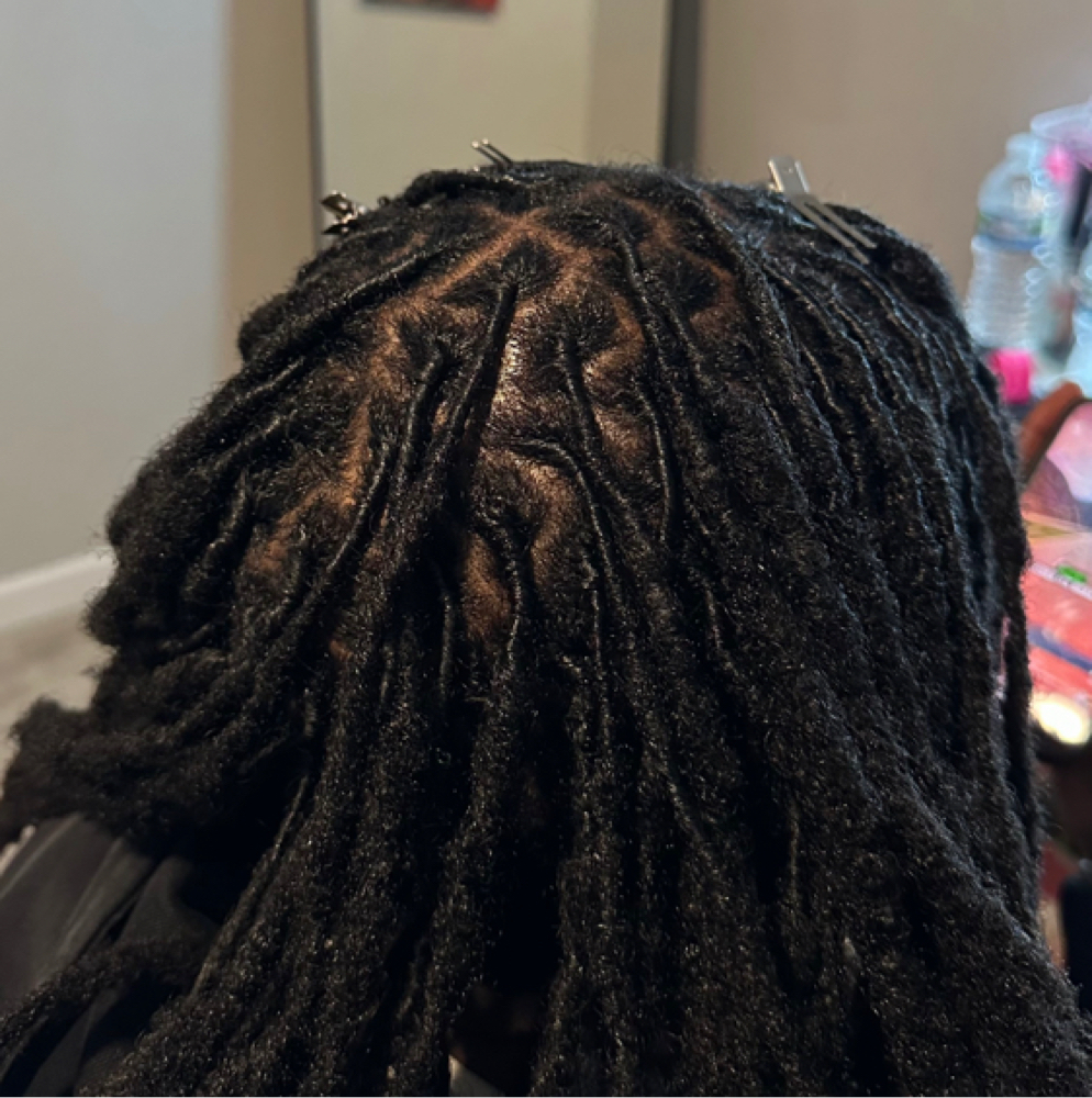 Loc Retwisting and Styling at TwistedByMads in terre haute, IN