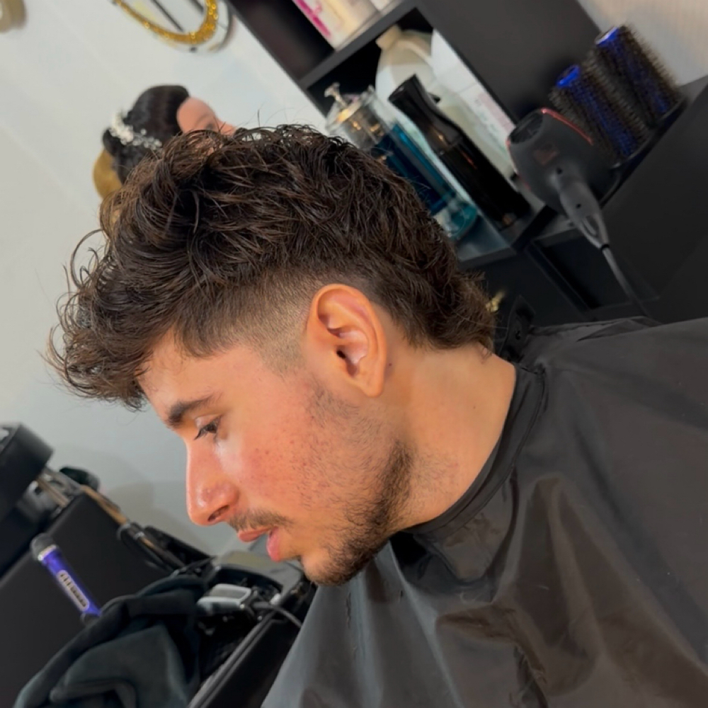 Men's haircut at Triumph Beauty Salon in Houston, TX