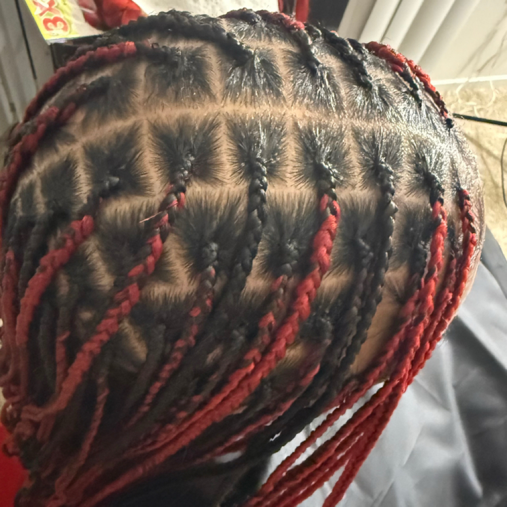 Medium knotless butt length at Yunis hair braiding in Belleville, MI