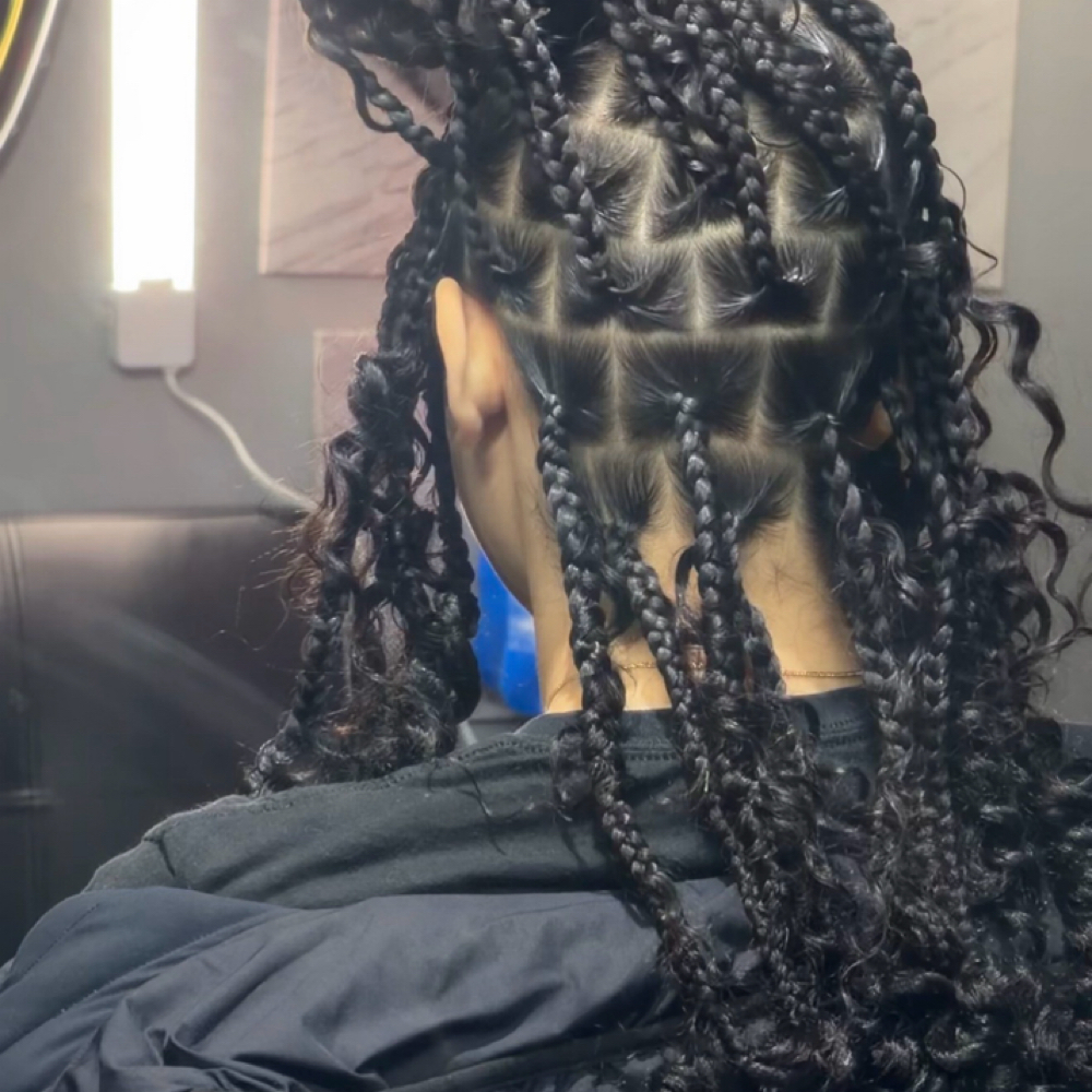 Knotless box braids at ImpressMeStudio in Rochester, NY