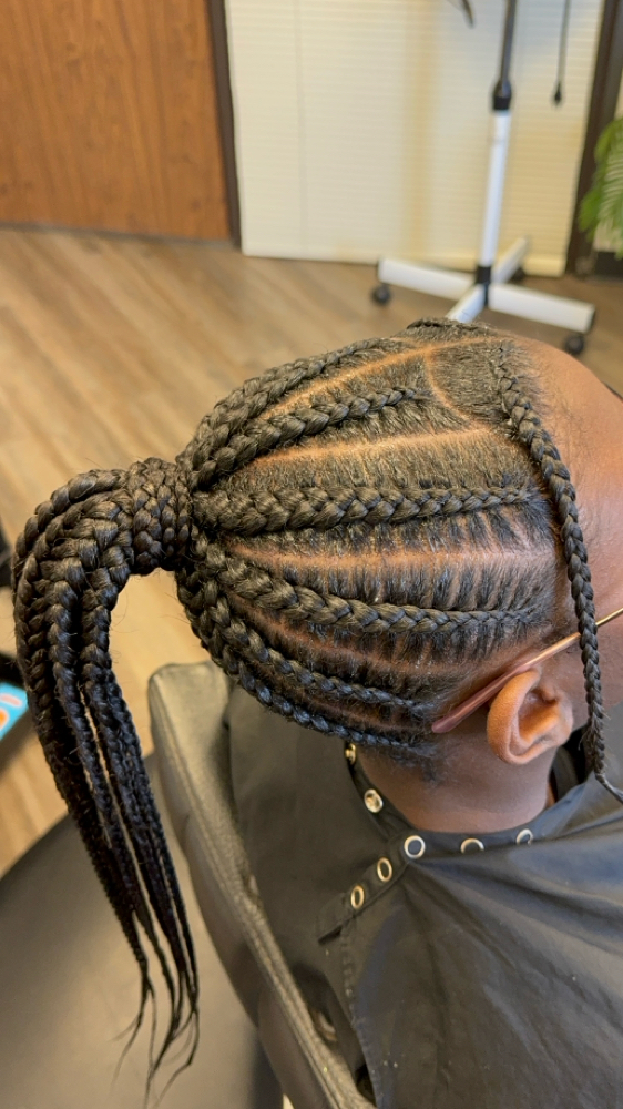 Stitched Cornrow Ponytail at Crowned by Asia in Houston, TX