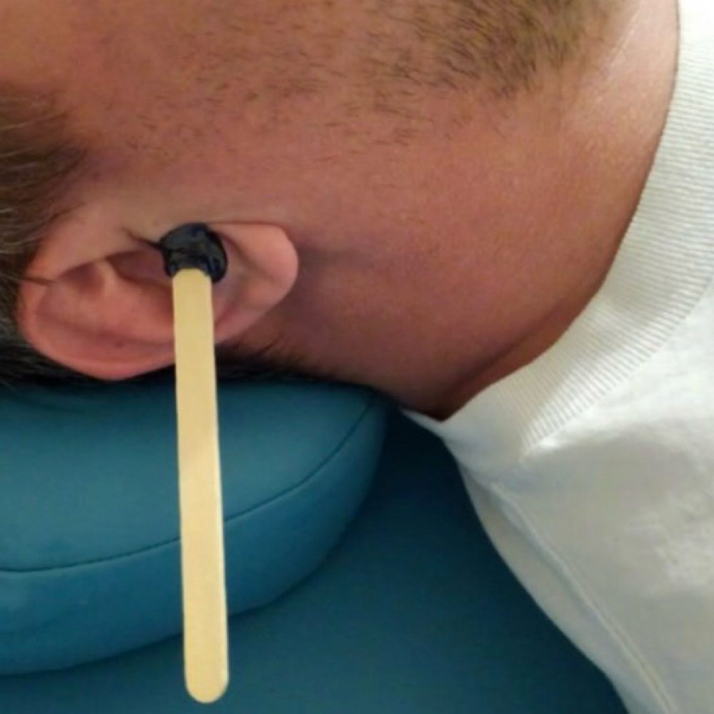 Ear Wax at SKIN by Christine Russell in Green Bay, WI