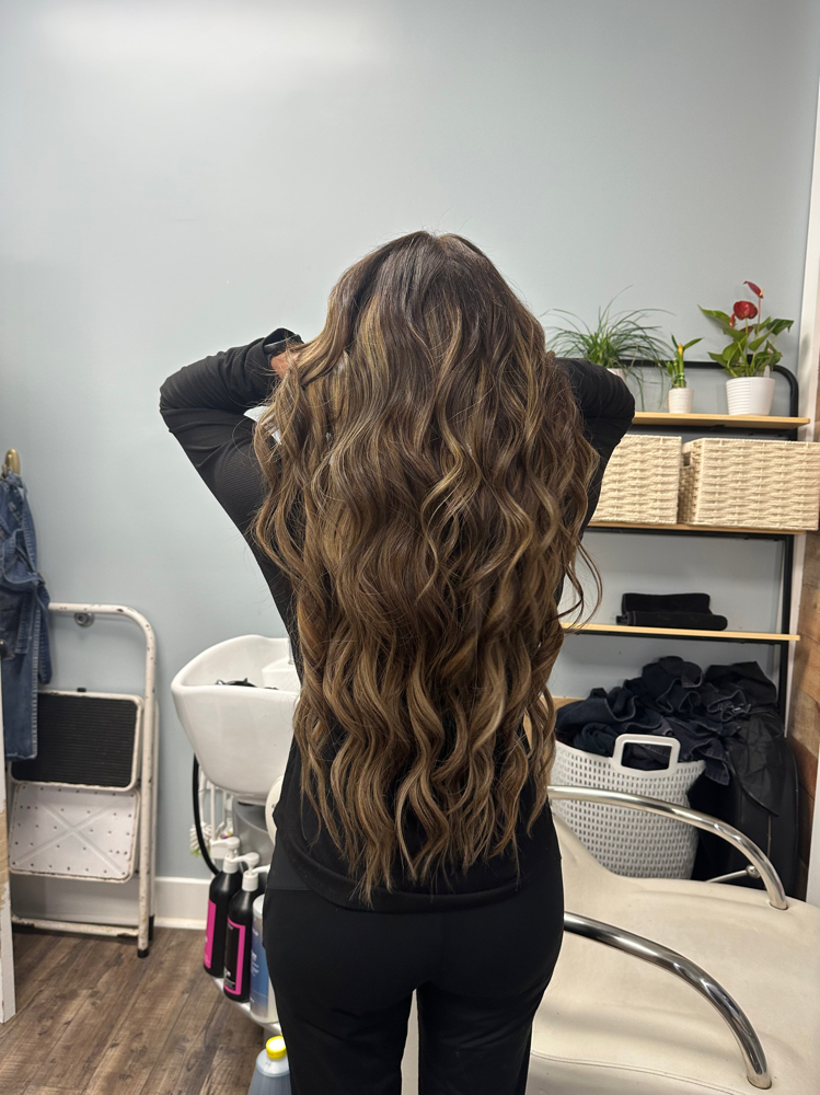 Volume weft sew in hair extensions installation at Zamora Allure in Concord, NC