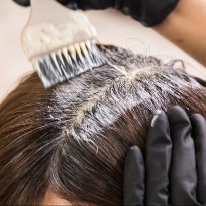 Root touch-up one color at Blossoms HTX Hair Studio in Spring, TX