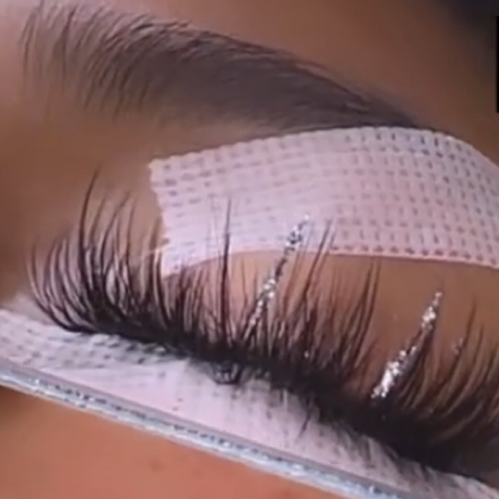 Add Glitter Lashes at At Ease Studio by Kambria Star in Fort Wayne, IN