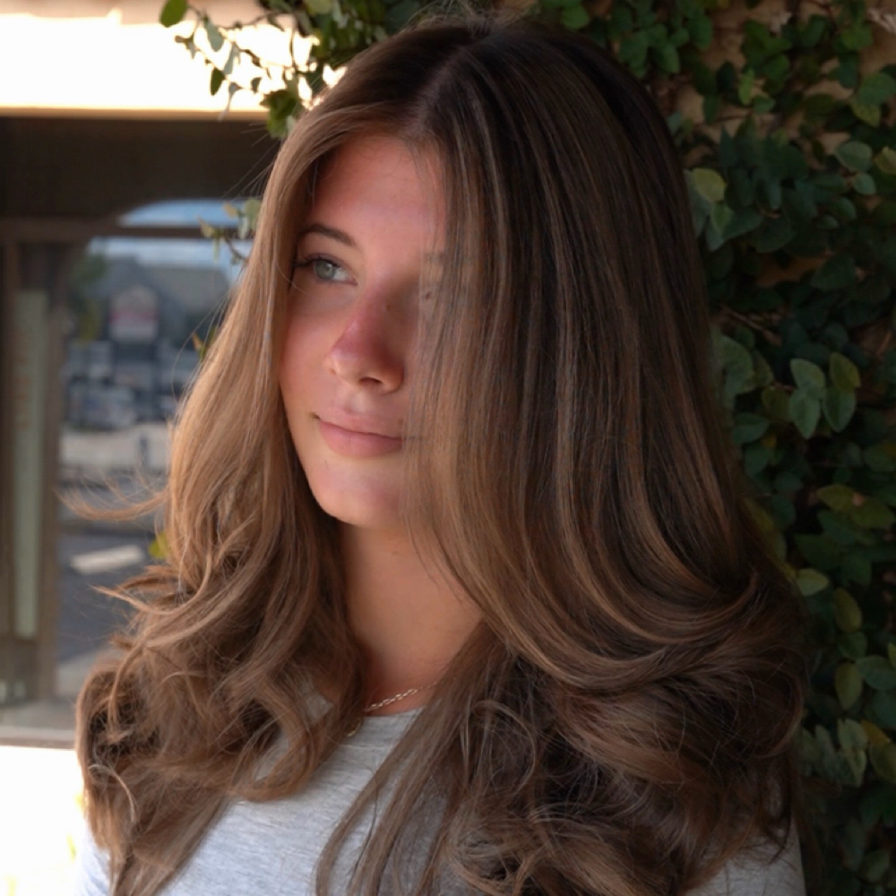 Silk Press Or Blow Out at Sunshine Curls in Tampa, FL
