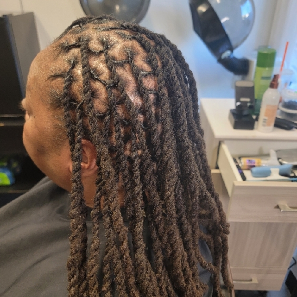 Locs retwist with 2-strand twist