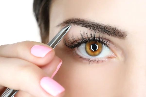 Grooming Eyebrows with Tweezer