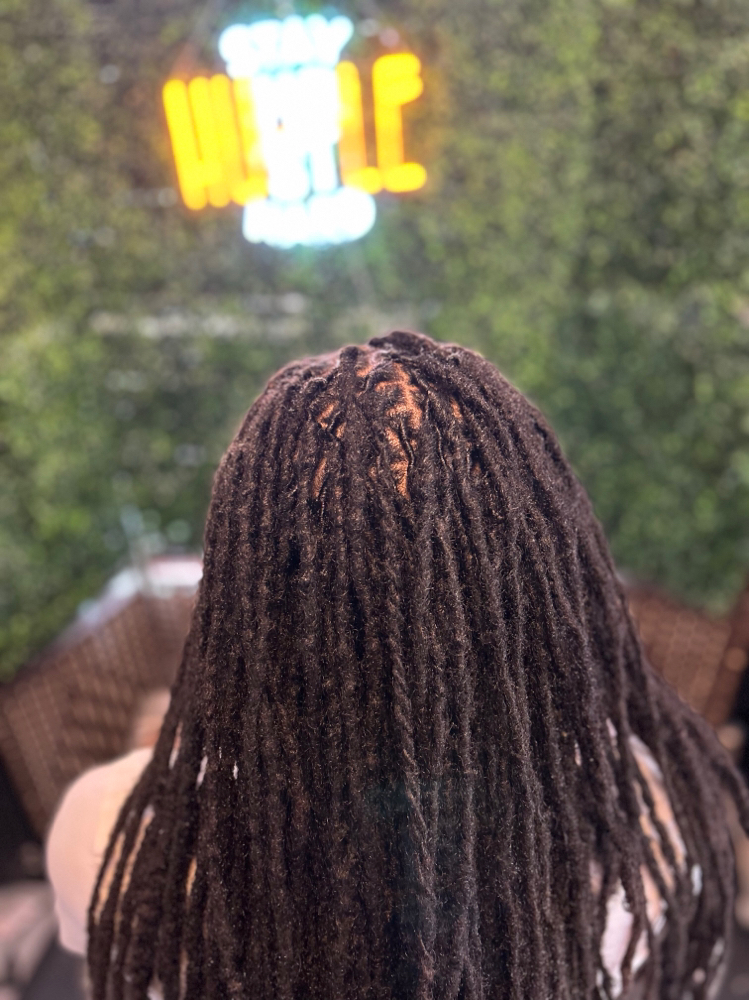 Loc Retwist at Ja’Tae Style Studio LLC in Euclid, OH