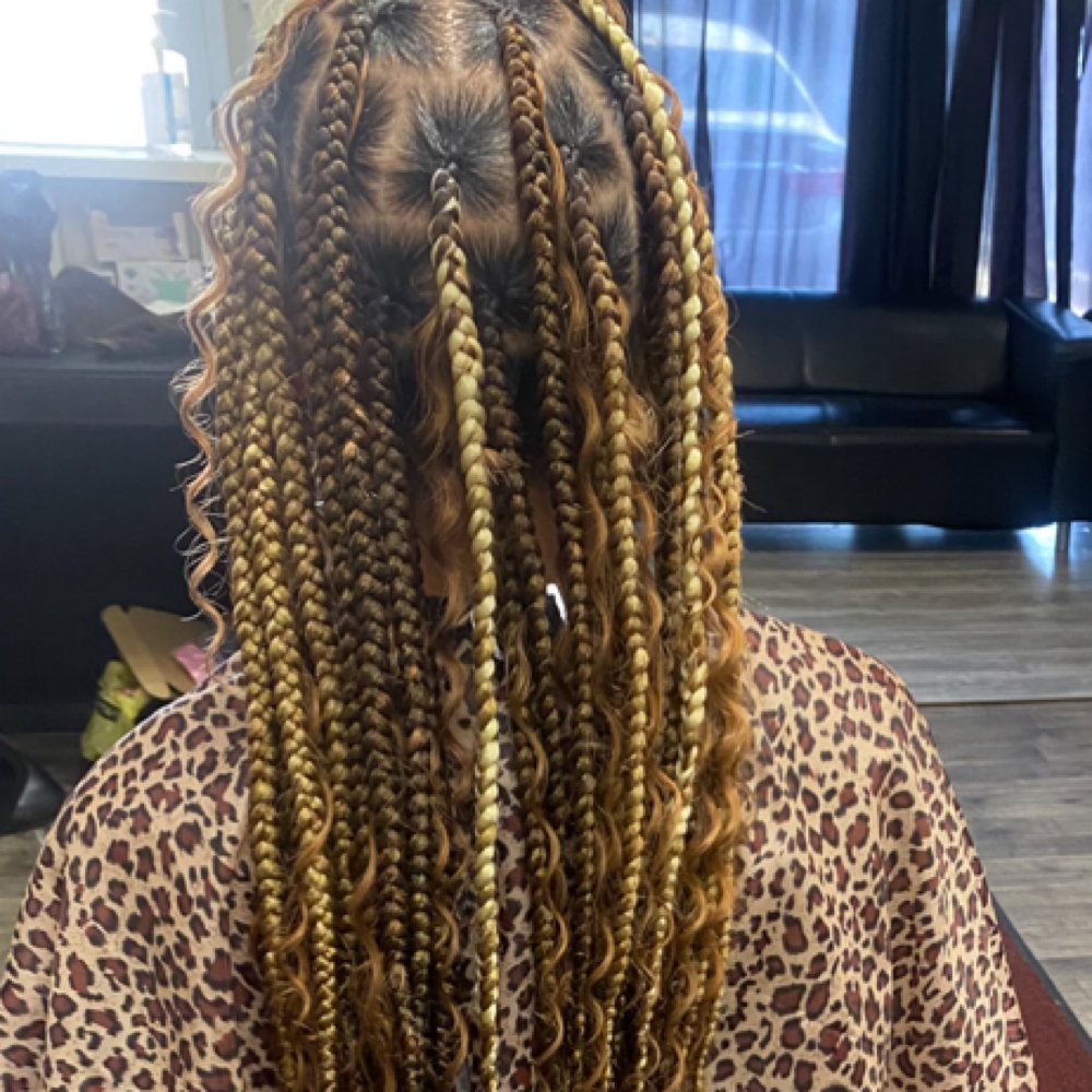 Jumbo Boho Knotless LowerBack at Crowned Braids Salon in Conway, SC