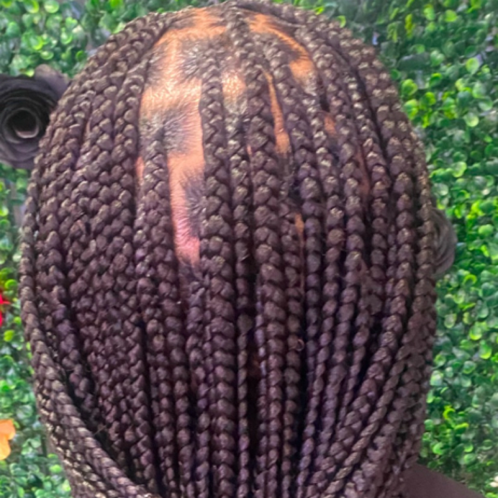 Medium Knotless Mid Back at Crowned Braids Salon in Conway, SC
