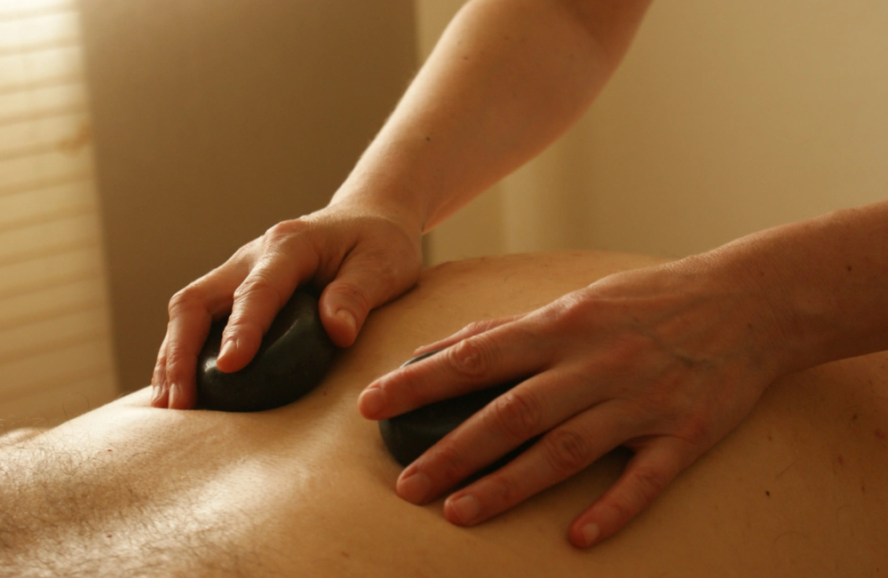 Hot Stones Massage at Stacie Robinson, LMT at Thrive Body Spa in Caribou, ME