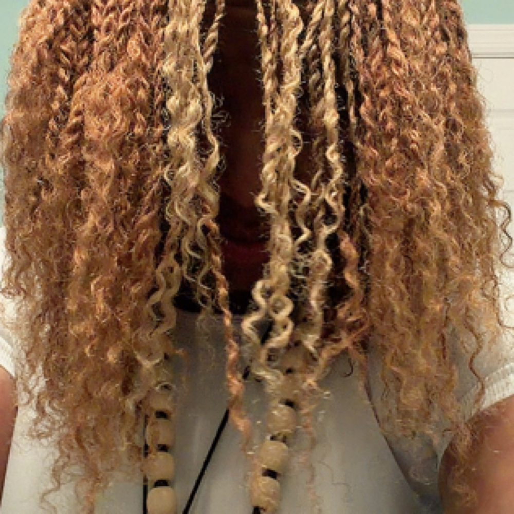 Adding Curly Ends To Microlocs at LISA DID IT BRAIDS & LOCS in Martinez, GA