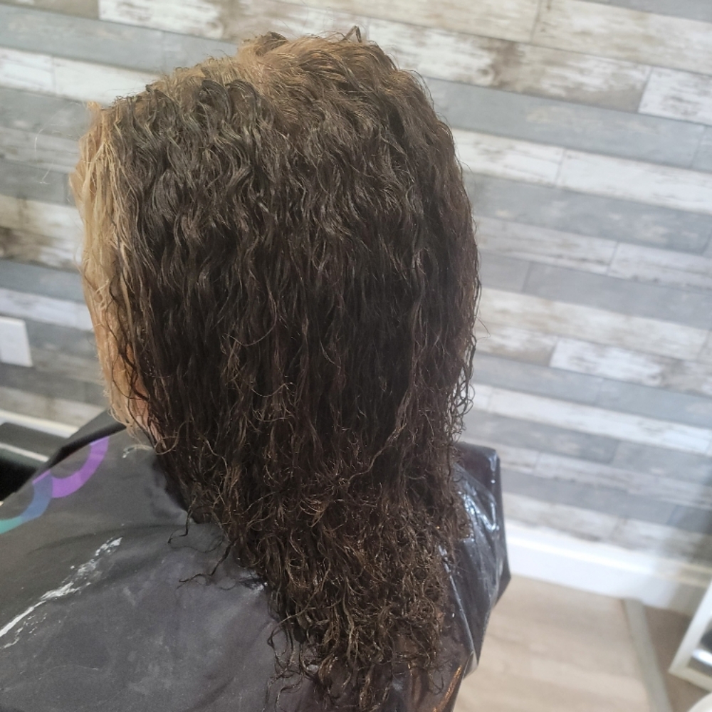 Perm Long at Devins Beauty Studio in Sanford, MI