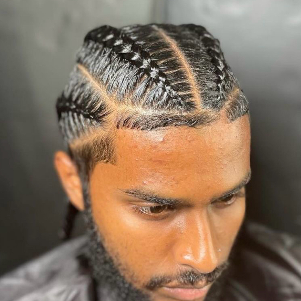 Men Four Braids In A  Bun at Zara Hair Braiding Salon in 30328