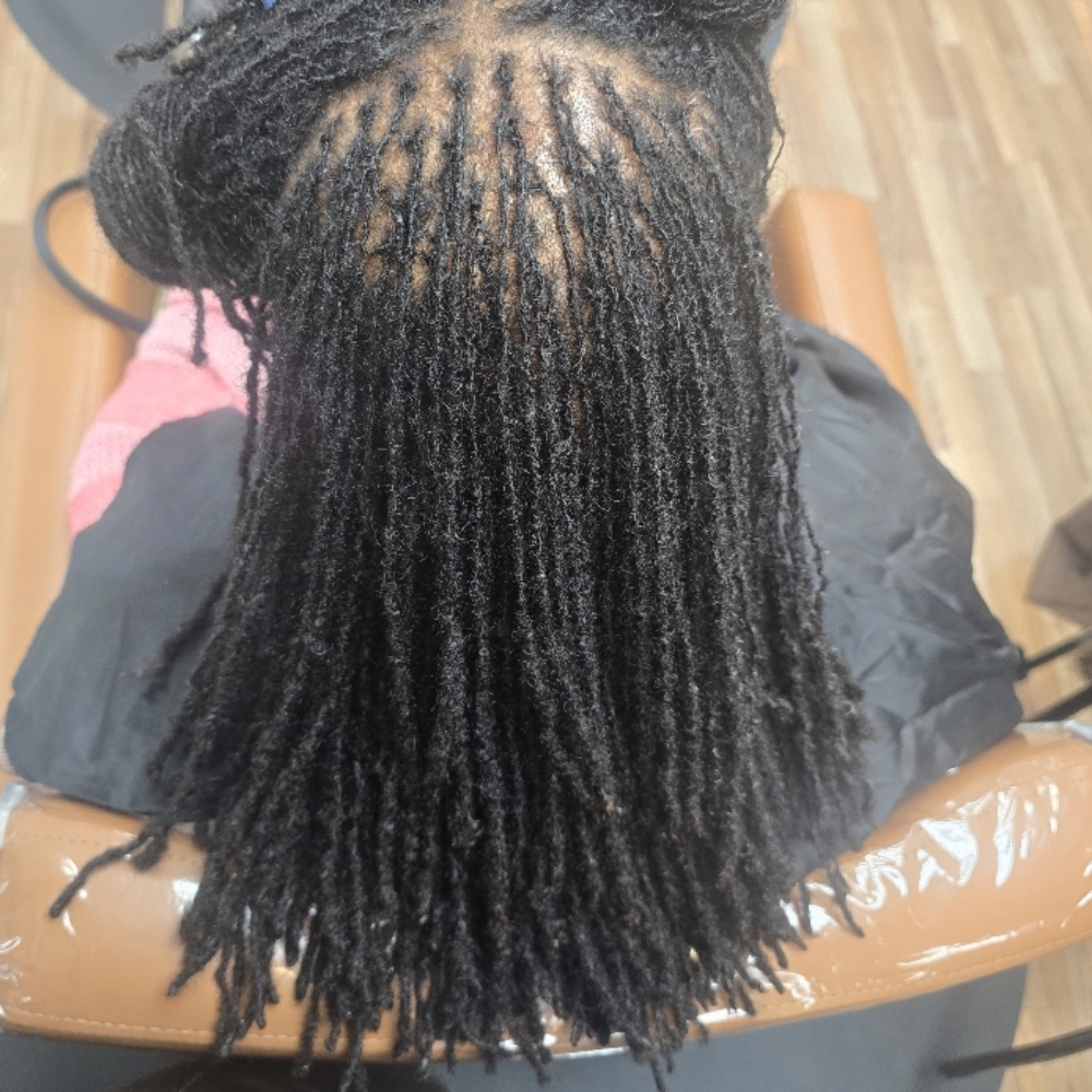 Loc retie at The collective salon and barber spa inc in Locust Grove, GA