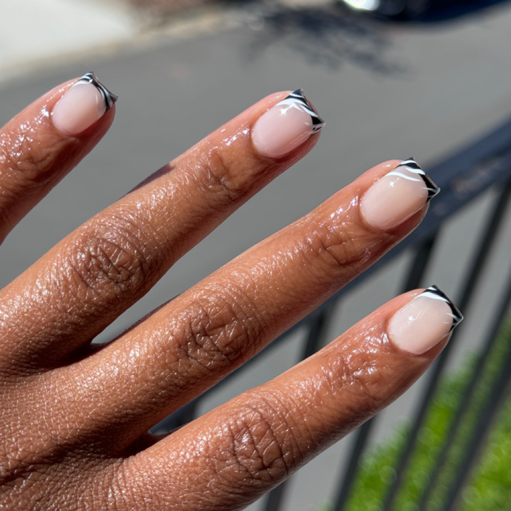 French Tips + Hand Painted at NL Visions Beauty Studio in Greensboro, NC